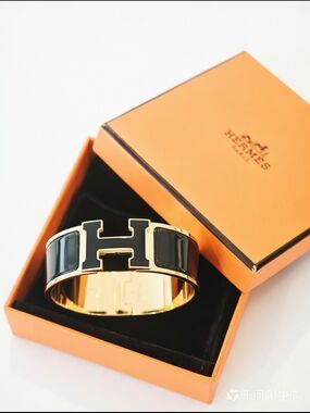 Hermès Clic H Enamel Bangle in Black and Gold